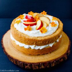 PEACHES AND CREAM CAKE. A simple 3-ingredient sponge cake with a fresh peaches and cream filling and finished with a cloud of whipped topping.