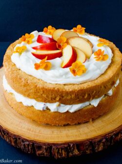 PEACHES AND CREAM CAKE. A simple 3-ingredient sponge cake with a fresh peaches and cream filling and finished with a cloud of whipped topping.