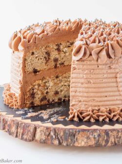 BANANA CHOCOLATE CHIP CAKE WITH MILK CHOCOLATE FROSTING. A deliciously moist chocolate chip banana cake surrounded with a real milk chocolate buttercream.