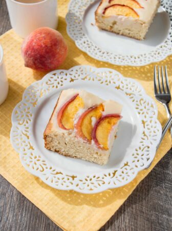 PEACHES AND CREAM COFFEE CAKE. A delicious sour cream coffee cake, topped with a velvety cream cheese mousse and juicy fresh peaches. Melt-in-your-mouth good!