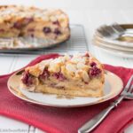 Buttery flaky croissants, ripe juicy berries and crunchy almonds all baked in a luscious custard makes this cake absolutely irresistible.