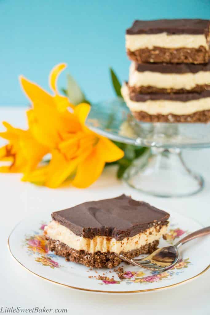 A creamy layer of vanilla custard flavored cheesecake sandwiched between a chocolatey coconut cookie crumb base and semi-sweet chocolate ganache. A twist to one of Canada's best known desserts. {Video Recipe}