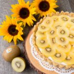 A coconut graham cracker crust topped with Greek yogurt and delicious ripe golden kiwifruit. This no-bake dessert is tasty, healthy and easy to make. {Video Recipe} #Zespri4Life #Sponsored