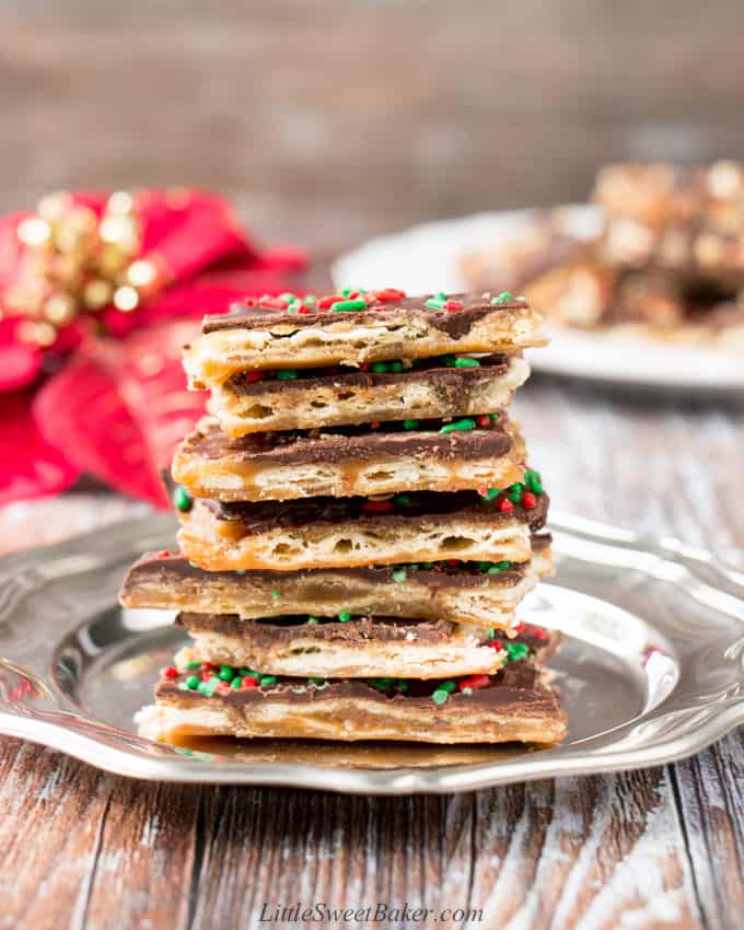 A stack of Christmas Crack on a silver plate.