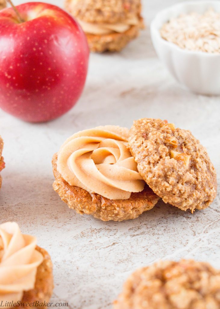 A creamy, sweet and salty peanut butter frosting sandwiched between two soft and chewy apple oatmeal cookies makes these whoopie pies absolutely irresistible.