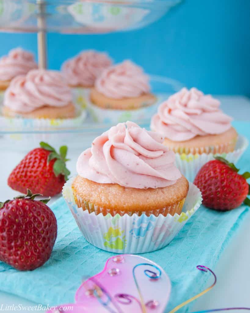 These moist and buttery vanilla cupcakes are soft pink in color and topped with a strawberry reduction buttercream. I made them for my best friend's baby shower and they were a hit!