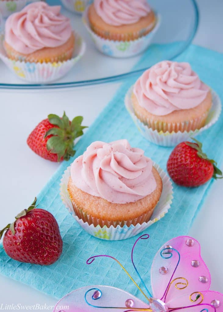 These moist and buttery vanilla cupcakes are soft pink in color and topped with a strawberry reduction buttercream. I made them for my best friend's baby shower and they were a hit!