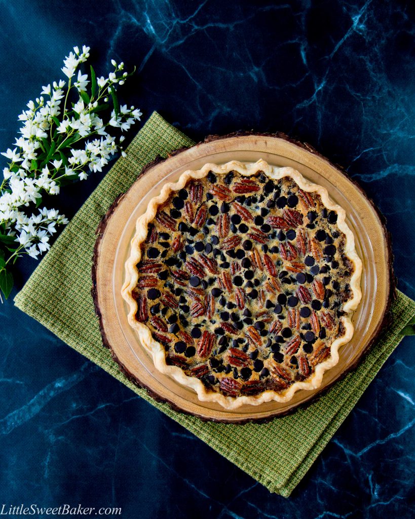 This pie combines crunchy pecans with the intense flavor of dark chocolate in a sweet-gooey filling. The addition of bourbon gives it a grown-up flair.
