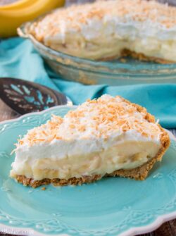 This amazing banana cream pie is made with a rich velvety-smooth homemade custard and it's lined with a honey graham cracker crust. Filled with delicious sweet slices of bananas and topped with fluffy whipped cream - it'a absolutely pie heaven! banana cream pie | best banana cream pie | easy banana cream pie | old-fashioned banana cream pie | homemade custard | coconut banana cream pie | graham cracker crust