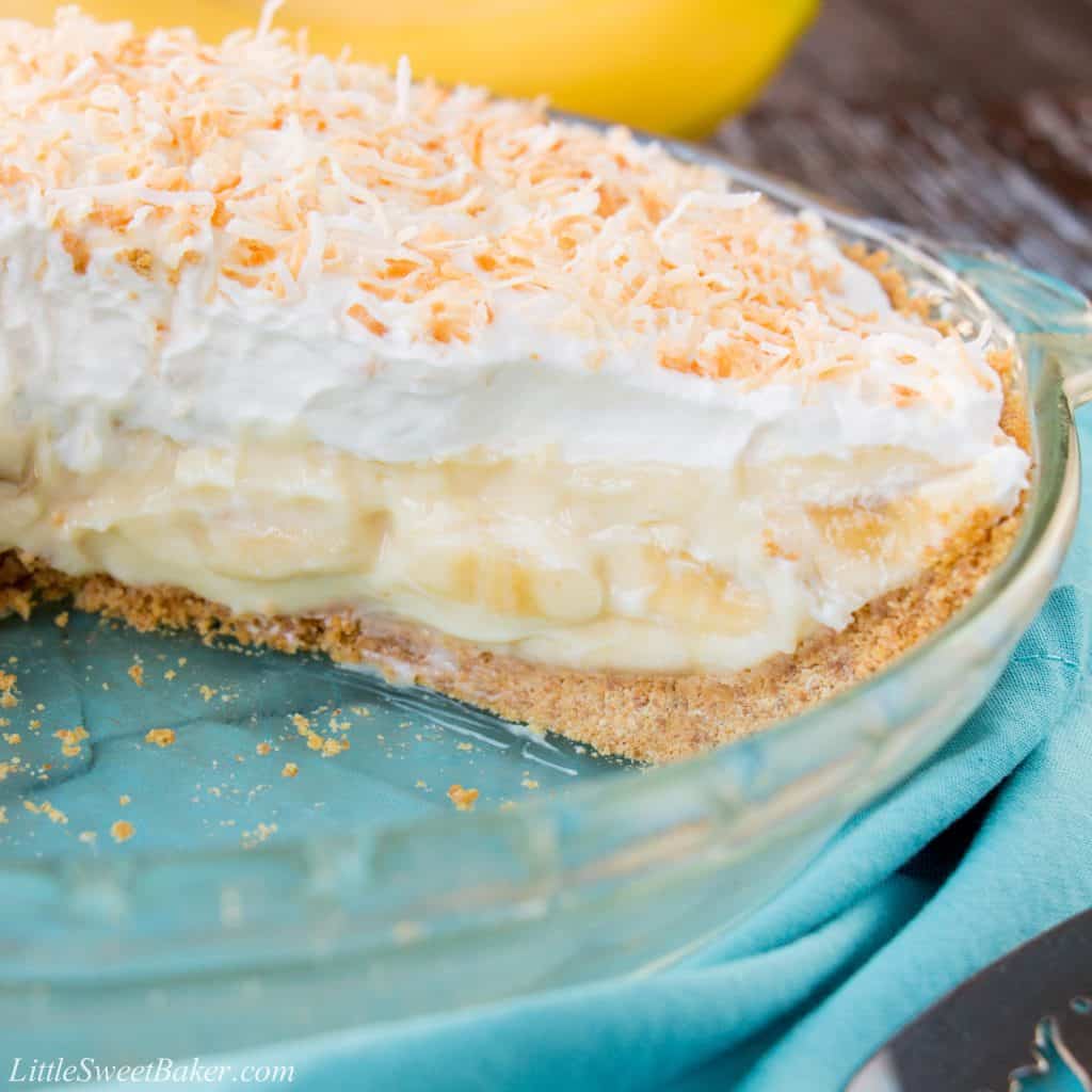 This amazing banana cream pie is made with a rich velvety-smooth homemade custard and it's lined with a honey graham cracker crust. Filled with delicious sweet slices of bananas and topped with fluffy whipped cream - it'a absolutely pie heaven! banana cream pie | best banana cream pie | easy banana cream pie | old-fashioned banana cream pie | homemade custard | coconut banana cream pie | graham cracker crust