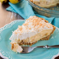 This amazing banana cream pie is made with a rich velvety-smooth homemade custard and it's lined with a honey graham cracker crust. Filled with delicious sweet slices of bananas and topped with fluffy whipped cream - it'a absolutely pie heaven! banana cream pie | best banana cream pie | easy banana cream pie | old-fashioned banana cream pie | homemade custard | coconut banana cream pie | graham cracker crust