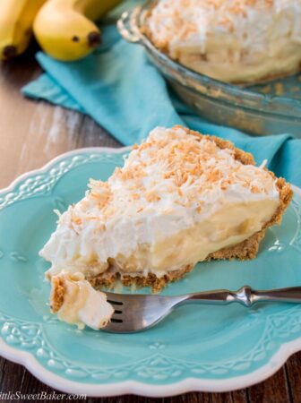 This amazing banana cream pie is made with a rich velvety-smooth homemade custard and it's lined with a honey graham cracker crust. Filled with delicious sweet slices of bananas and topped with fluffy whipped cream - it'a absolutely pie heaven! banana cream pie | best banana cream pie | easy banana cream pie | old-fashioned banana cream pie | homemade custard | coconut banana cream pie | graham cracker crust