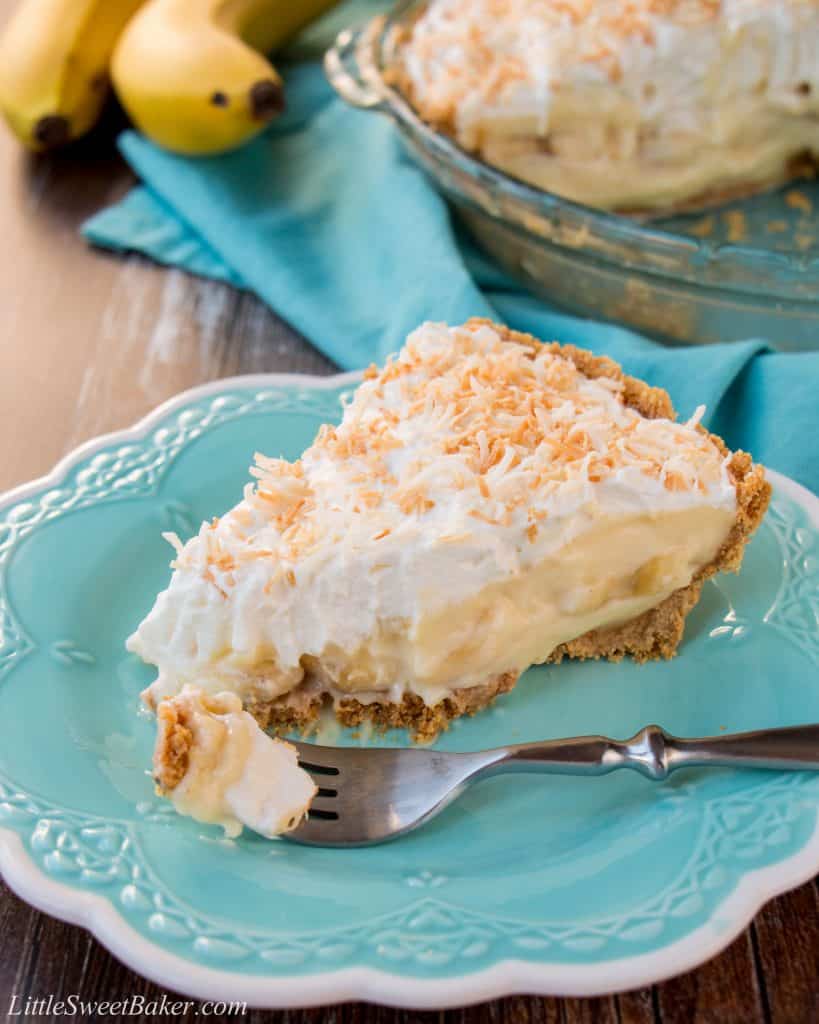 This amazing banana cream pie is made with a rich velvety-smooth homemade custard and it's lined with a honey graham cracker crust. Filled with delicious sweet slices of bananas and topped with fluffy whipped cream - it'a absolutely pie heaven! banana cream pie | best banana cream pie | easy banana cream pie | old-fashioned banana cream pie | homemade custard | coconut banana cream pie | graham cracker crust