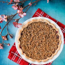 Enjoy this fabulous cherry pie all year round by using fresh, frozen or even jarred cherries with this easy and adaptable recipe. It's the best homemade cherry pie filling topped with a crunchy streusel topping and wrapped in a flaky pie crust. Cherry pie | sour cherry pie | best cherry pie | easy cherry pie | fresh cherry pie | cherry pie using frozen cherries