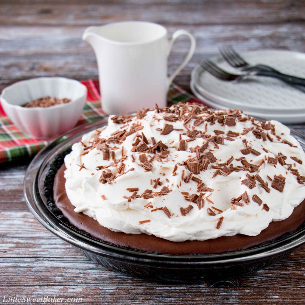 This chocolate pudding pie is made with a rich and silky homemade pudding over a chocolate cookie crust. It's topped with billowy clouds of whipped cream and sprinkled with chocolate shavings. #chocolatepuddingpie #easychocolatepuddingpie #bestchocolatepuddingpie #Thanksgivingdesserts #AD #milkcalendar