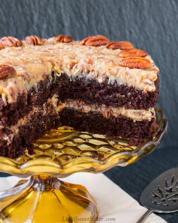 A German chocolate cake with a quarter of it cut out.