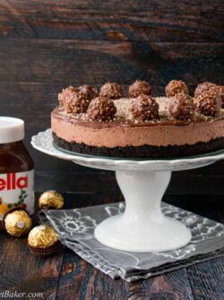 Oreo cookie crust with a Nutella cheesecake filling, topped with more Nutella and decorated with Ferrero Rocher candies. This no-bake recipe is the easiest and most delicious Nutella cheesecake you will ever make!