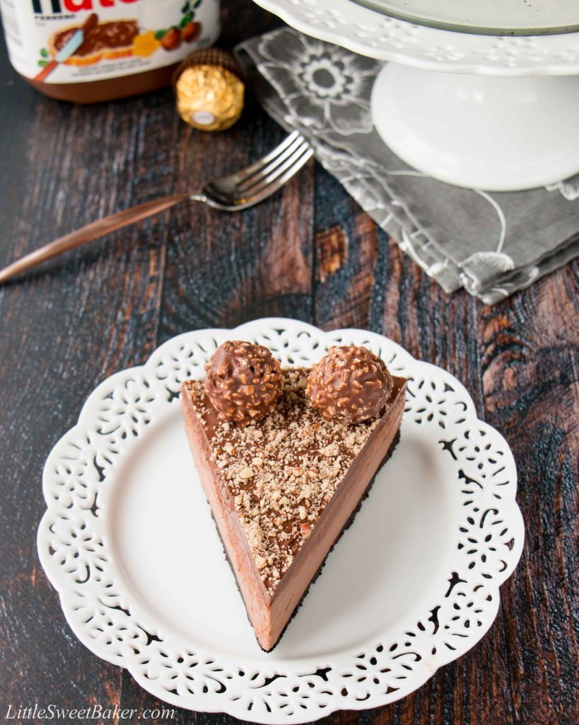 Oreo cookie crust with a Nutella cheesecake filling, topped with more Nutella and decorated with Ferrero Rocher candies. This no-bake recipe is the easiest and most delicious Nutella cheesecake you will ever make!