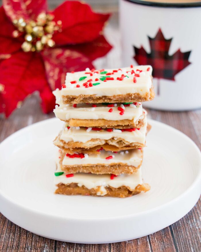 A stack of white chocolate Christmas crack on a small white plate.