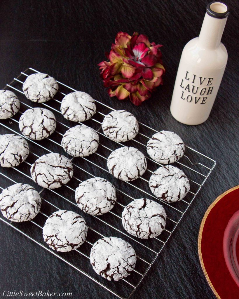 These fudgy chocolate crinkle cookies are rich and chewy like brownie bites rolled in powdered sugar. #chocolatecrinklecookies #browniecookies #Christmascookie #crinklecookies