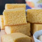 This moist, fluffy and tender cornbread is a perfect addition to any meal. This quick and easy recipe can be prepared, baked and ready to serve in under 30 minutes. #cornbreadrecipe #sweetcornbread #buttermilkcornbread #southerncornbread #easycornbread