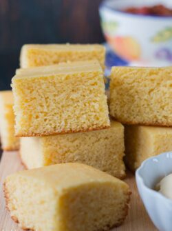 This moist, fluffy and tender cornbread is a perfect addition to any meal. This quick and easy recipe can be prepared, baked and ready to serve in under 30 minutes. #cornbreadrecipe #sweetcornbread #buttermilkcornbread #southerncornbread #easycornbread