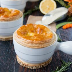 These mini chicken pot pies are topped with a flaky puff pastry and filled with rice, veggies and chicken in a creamy lemon sauce. #chickenpotpie #minichickenpotpies #chickenandrice #ReachForRice #Ad #usaricecan