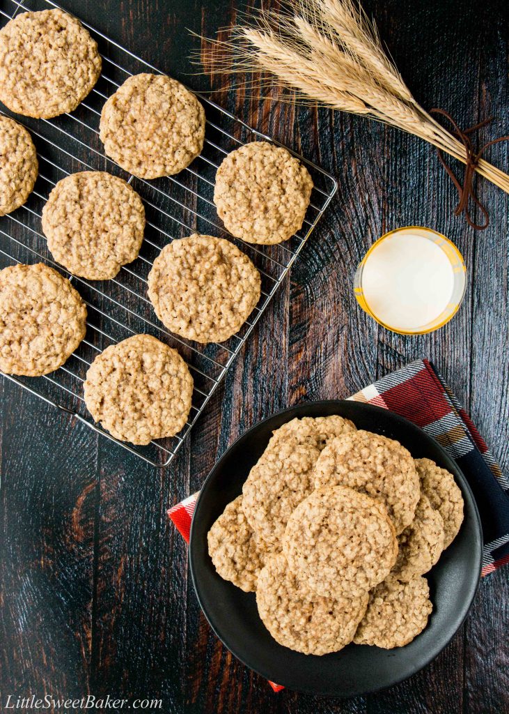 overhead view of oatmeal cookies on a plate and cooling rack