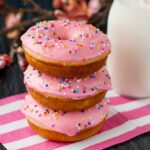 These baked donuts are soft, fluffy, and so much healthier than fried donuts, but just as tasty! #vanilladonuts #bakeddonuts #homemadedonuts #vanillaglaze #glazeddonuts