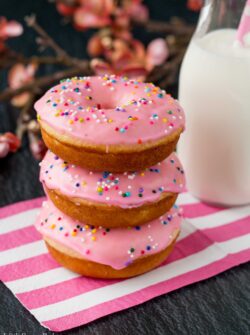 These baked donuts are soft, fluffy, and so much healthier than fried donuts, but just as tasty! #vanilladonuts #bakeddonuts #homemadedonuts #vanillaglaze #glazeddonuts
