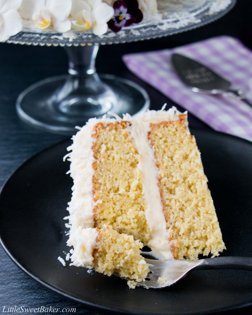 This delicious made-from-scratch coconut cake is infused with natural coconut flavor and topped with a sweet-tangy cream cheese frosting. #coconutcake #southerncoconutcake #bestcoconutcake #inagartencoconutcake #easycoconutcake #easterdessert