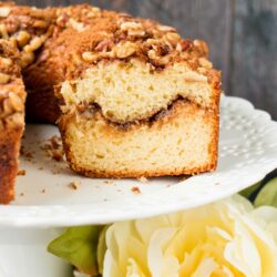 This soft, moist and tender coffee cake with its layers of cinnamon and brown sugar streusel is guaranteed to be your most requested dessert. #coffeecake #sourcreamcoffeecake #cinnamoncoffeecake #walnutcoffeecake