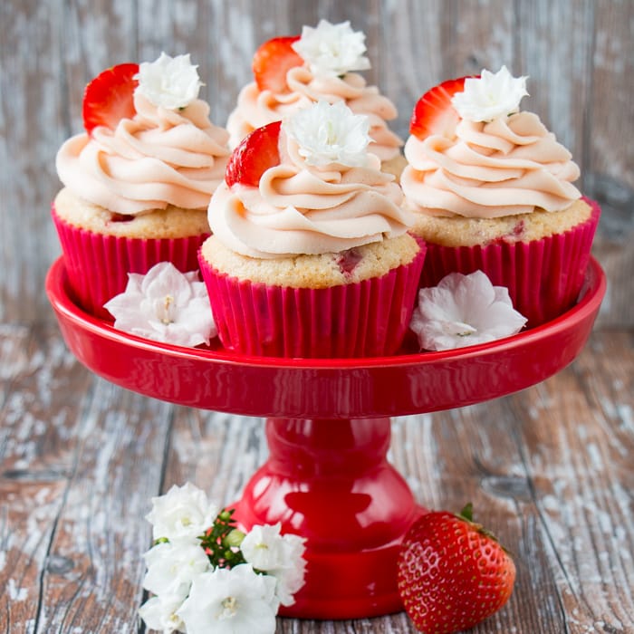 These fresh strawberry cupcakes are made from scratch with real strawberries and topped with a creamy strawberry buttercream. They are incredibly fluffy and moist, and full of fresh fruit flavor. #strawberrycupcakes #homemade #fresh #strawberrybuttercream