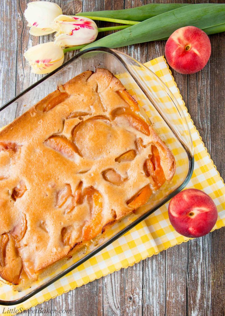 This heavenly peach cobbler consists of juicy flavorful peaches baked underneath a soft and fluffy cake topping. You can enjoy this made-from-scratch recipe all year round by using fresh, canned or even frozen peaches! #peachcobbler #easypeachcobbler #southernpeachcobbler