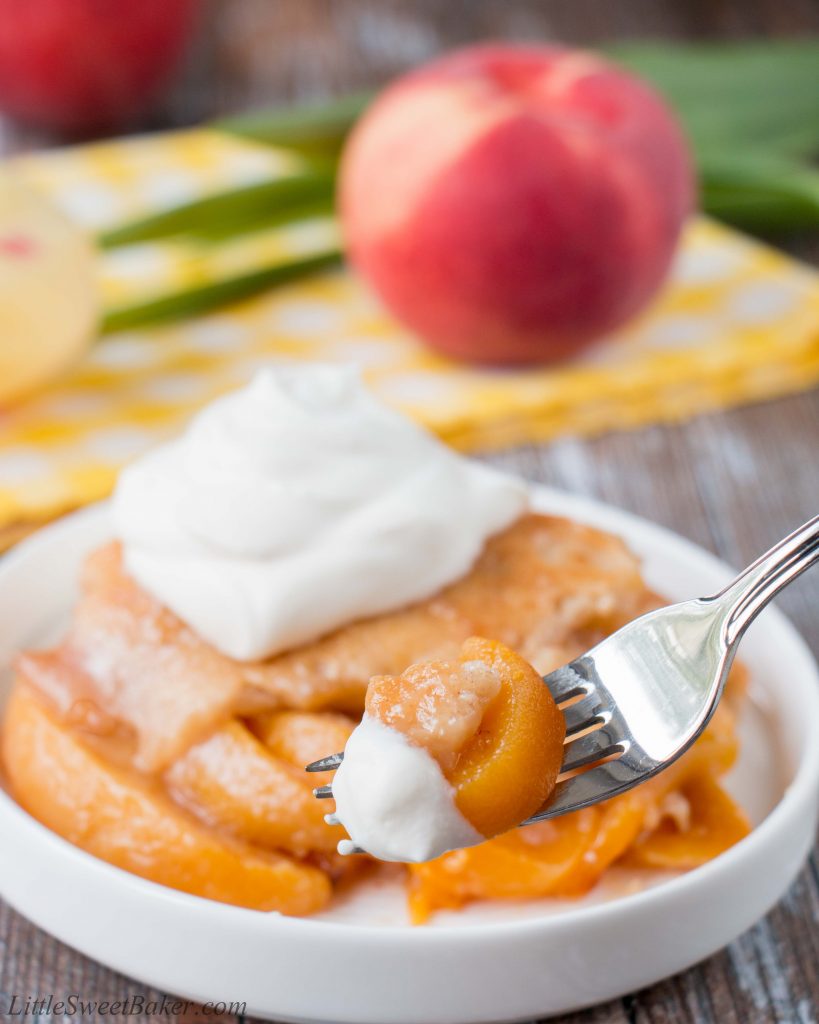 This heavenly peach cobbler consists of juicy flavorful peaches baked underneath a soft and fluffy cake topping. You can enjoy this made-from-scratch recipe all year round by using fresh, canned or even frozen peaches! #peachcobbler #easypeachcobbler #southernpeachcobbler