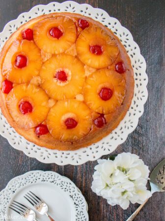 Sweet-juicy caramelized pineapple slices baked underneath a soft, rich and buttery cake, turned upside down to reveal a gorgeous presentation! #pineappleupsidedowncake #upsidedowncake #pineapplecake #buttercake