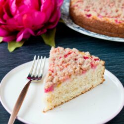 This is a tender and moist sour cream coffee cake topped with gorgeous chunks of rhubarb and a sweet-cinnamon streusel. #rhubarbcake #coffeecake #cinnamonstreusel