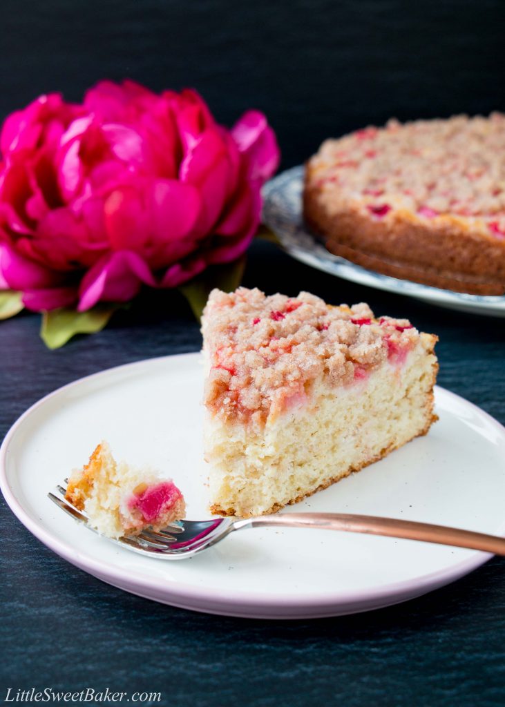 This is a tender and moist sour cream coffee cake topped with juicy pink chunks of rhubarb and a sweet-cinnamon streusel. #rhubarbcake #coffeecake #cinnamonstreusel
