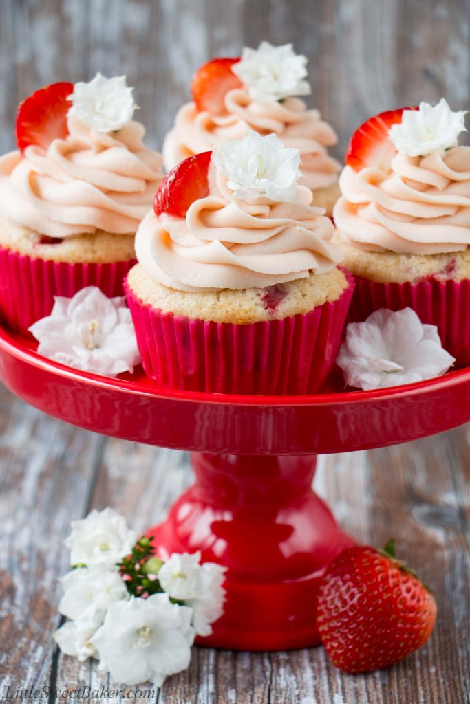 These fresh strawberry cupcakes are made from scratch with real strawberries and topped with a creamy strawberry buttercream. They are incredibly fluffy and moist, and full of fresh fruit flavor. #strawberrycupcakes #homemade #fresh #strawberrybuttercream