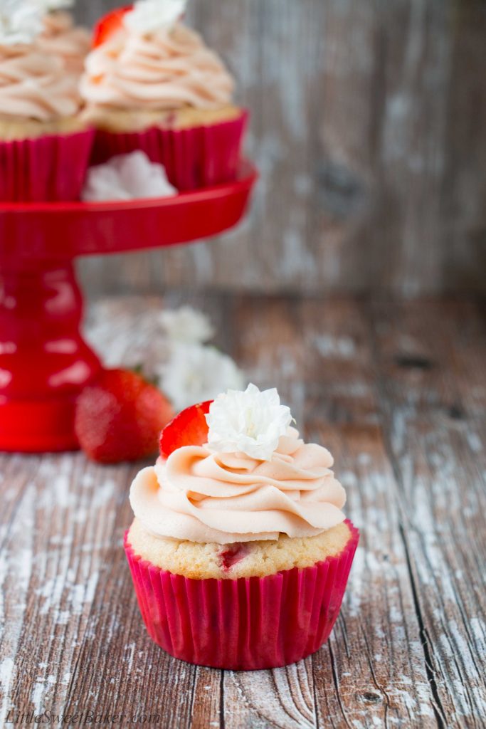 These fresh strawberry cupcakes are made from scratch with real strawberries and topped with a creamy strawberry buttercream. They are incredibly fluffy and moist, and full of fresh fruit flavor. #strawberrycupcakes #homemade #fresh #strawberrybuttercream