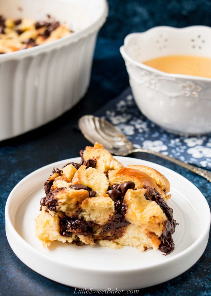 Chocolate chip bread pudding on a white plate.