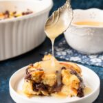 This classic recipe is elevated with the addition of chocolate and rich-buttery brioche bread. #breadpudding #chocolatechipbreadpudding #bourbonsauce #whiskeysauce #NewOrleansstyle