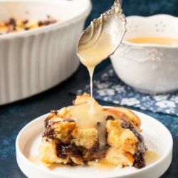 This classic recipe is elevated with the addition of chocolate and rich-buttery brioche bread. #breadpudding #chocolatechipbreadpudding #bourbonsauce #whiskeysauce #NewOrleansstyle