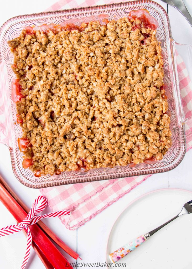 A top view of a square dish of rhubarb crisp with crunchy oat streusel
