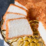 This moist, soft and fluffy angel food cake is a perfect summer dessert. It's light as air and is essentially fat-free! #angelfoodcake #easyangelfoodcake #angelfoodcakerecipe