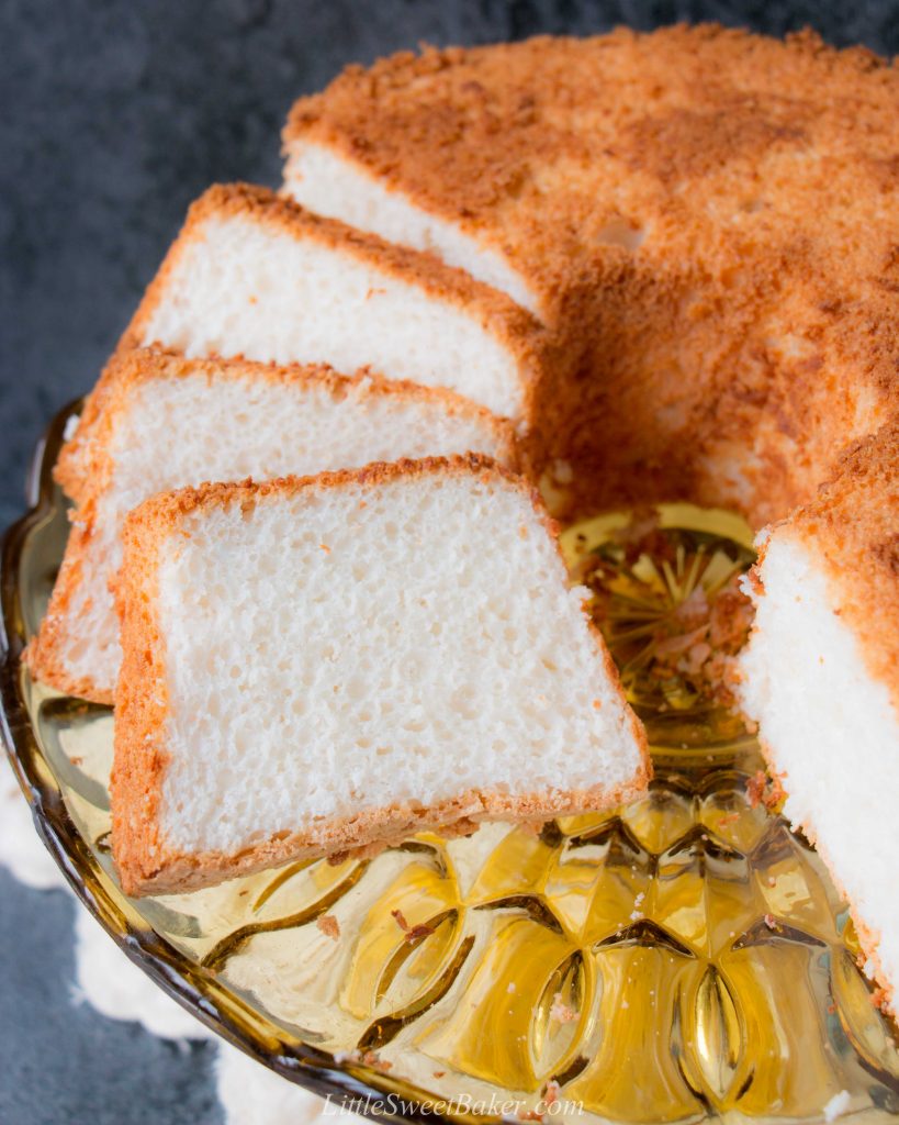 This moist, soft and fluffy angel food cake is a perfect summer dessert. It's light as air and is essentially fat-free! #angelfoodcake #easyangelfoodcake #angelfoodcakerecipe