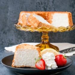 This moist, soft and fluffy angel food cake is a perfect summer dessert. It's light as air and is essentially fat-free! #angelfoodcake #easyangelfoodcake #angelfoodcakerecipe