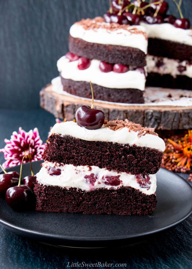 Easy Homemade Black Forest Cake - moist decadent chocolate cake surrounded by whipped cream and juicy black cherries. #blackforestcake #easyblackforestcake #blackforestgateau