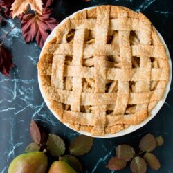 This incredible pear pie is sweetened with maple syrup and lightly spiced with ginger. The filling is made with fresh pears which gives it a lovely tender-crisp texture. #pearpie #gingerpearpie #maplepearpie #easypearpie