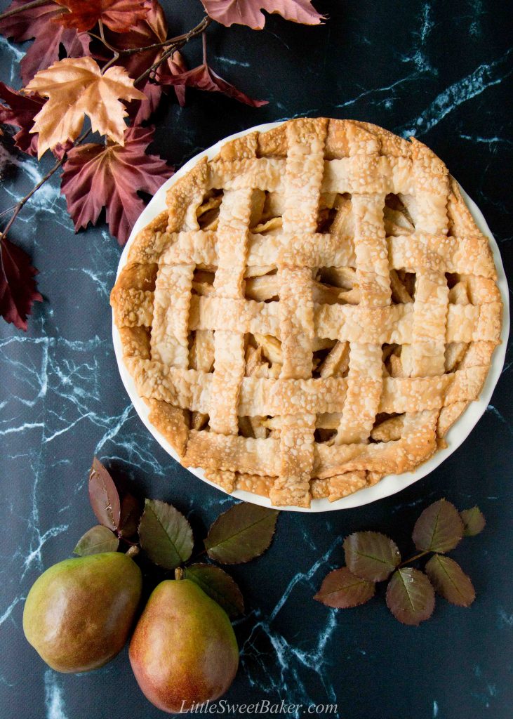 This incredible pear pie is sweetened with maple syrup and lightly spiced with ginger. The filling is made with fresh pears which gives it a lovely tender-crisp texture. #pearpie #gingerpearpie #maplepearpie #easypearpie